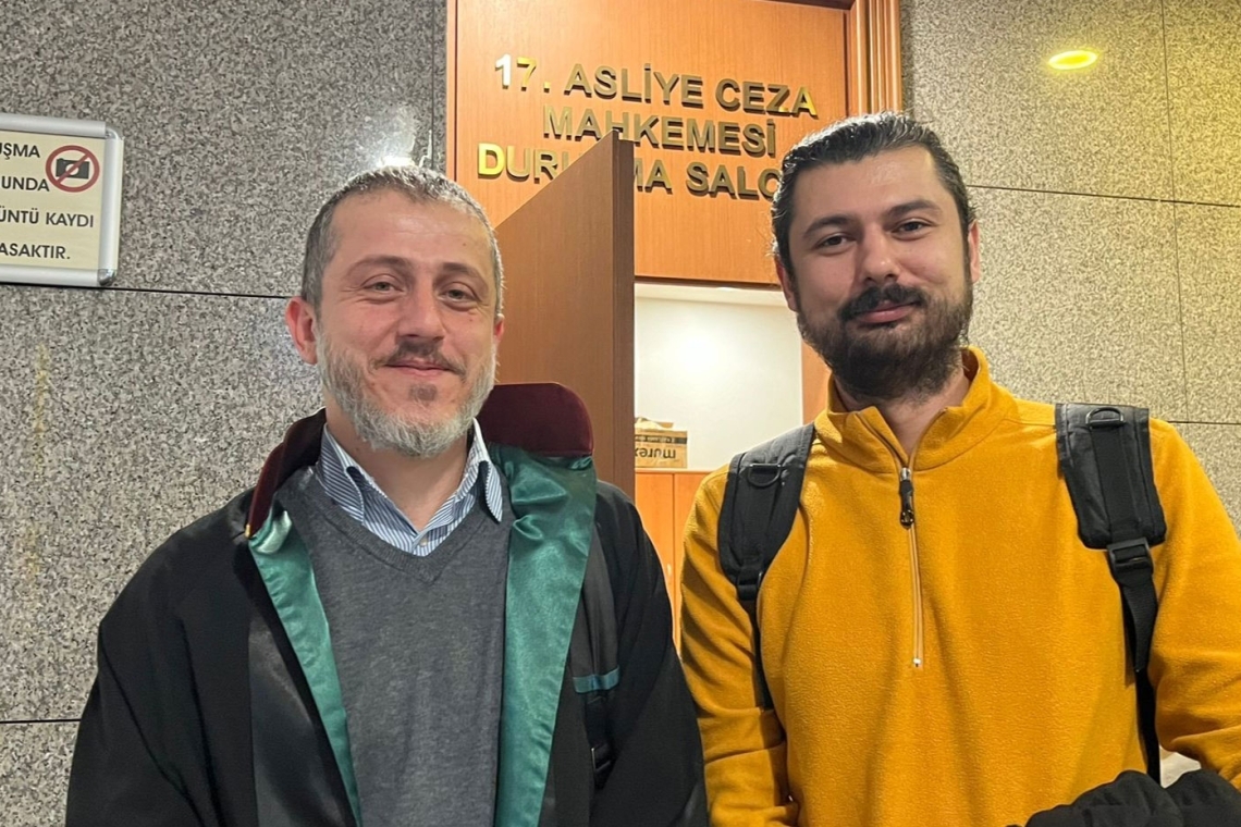Gökhan Başcan (R) and his lawyer